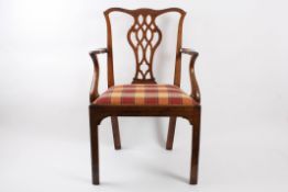 A George III oak carver armchair with pierced vase shaped splat, splayed curved arms, with