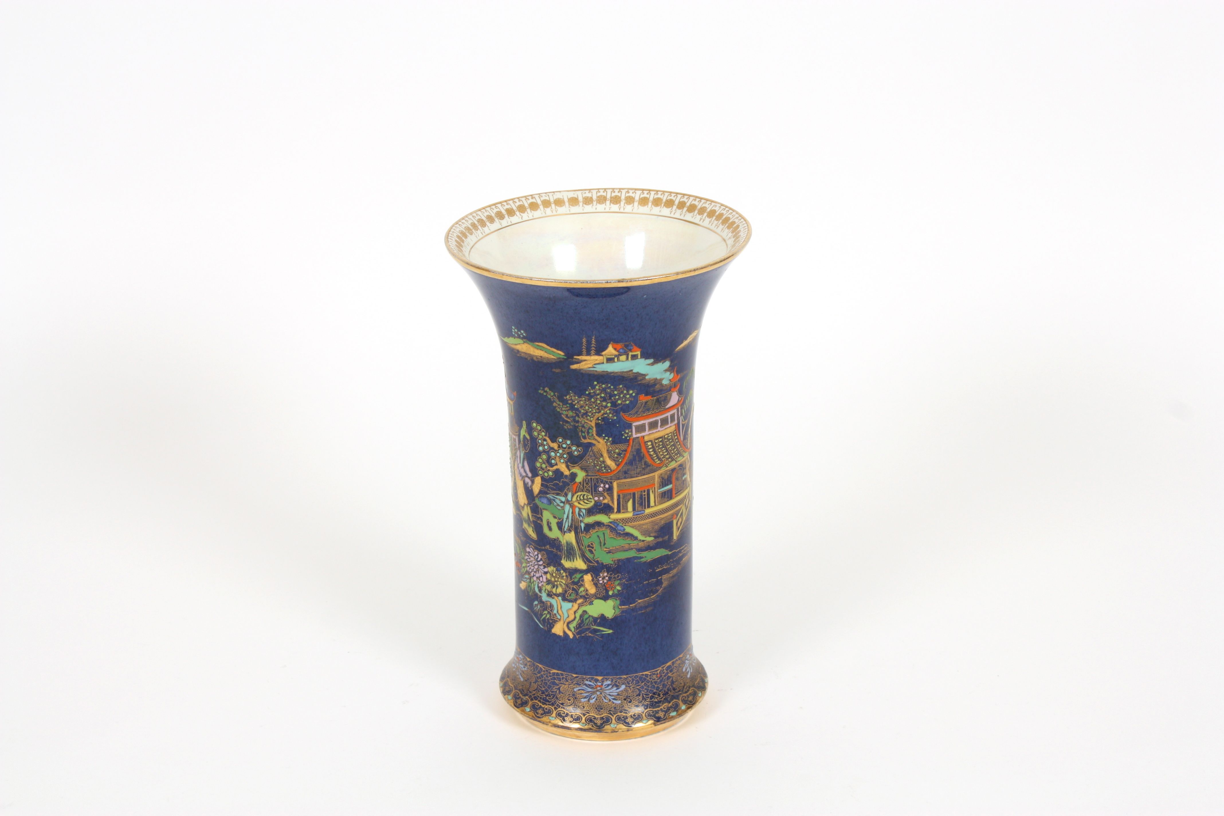 A large Carlton ware lustre vase the blue ground cylindrical body with flared neck and decorated
