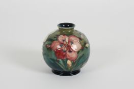 A Moorcroft Freesia globular vase the tubelined body decorated with alternating pink and cream