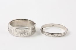 Two ladies silver bangles hallmarked Birmingham 1960 and 1972. 2.84 ozt. Clasp broken on larger