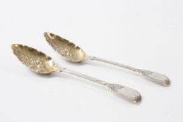 A Pair of George IV silver berry spoons hallmarked London 1821, with engraved stems and embossed and