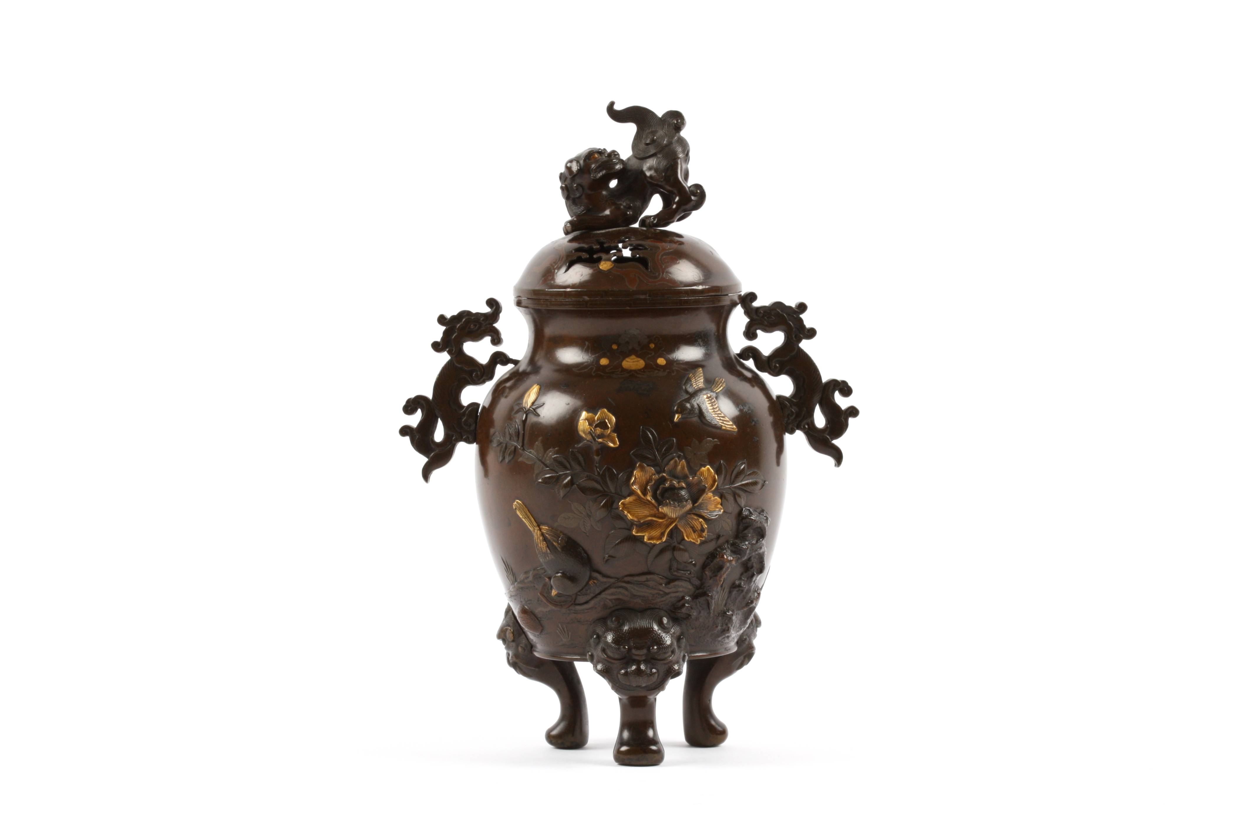 A Japanese Meiji period bronze two handled vase and cover the pierced lid crested with a dog of foe,