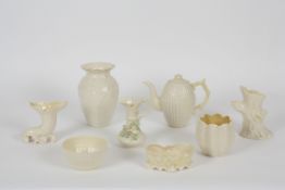 A collection of eight pieces of Belleek various dates  comprising a cream coffee pot decorated