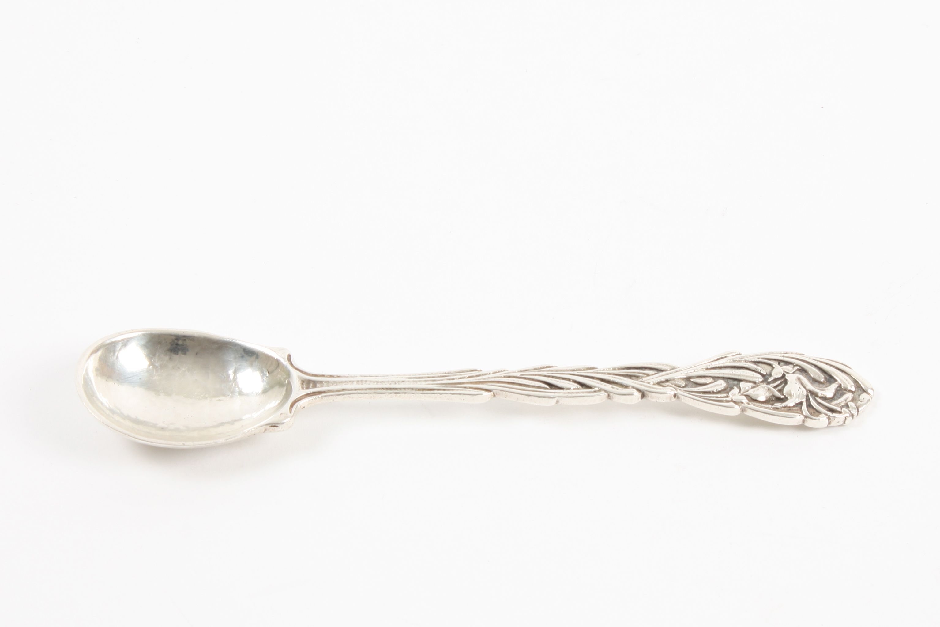 An Omar Ramsden Art Nouveau silver spoon hallmarked London 1930, with hammered bowl, the stem