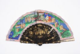 A mid 19th century painted black lacquer and paper fan Canton with painted wooden sticks with