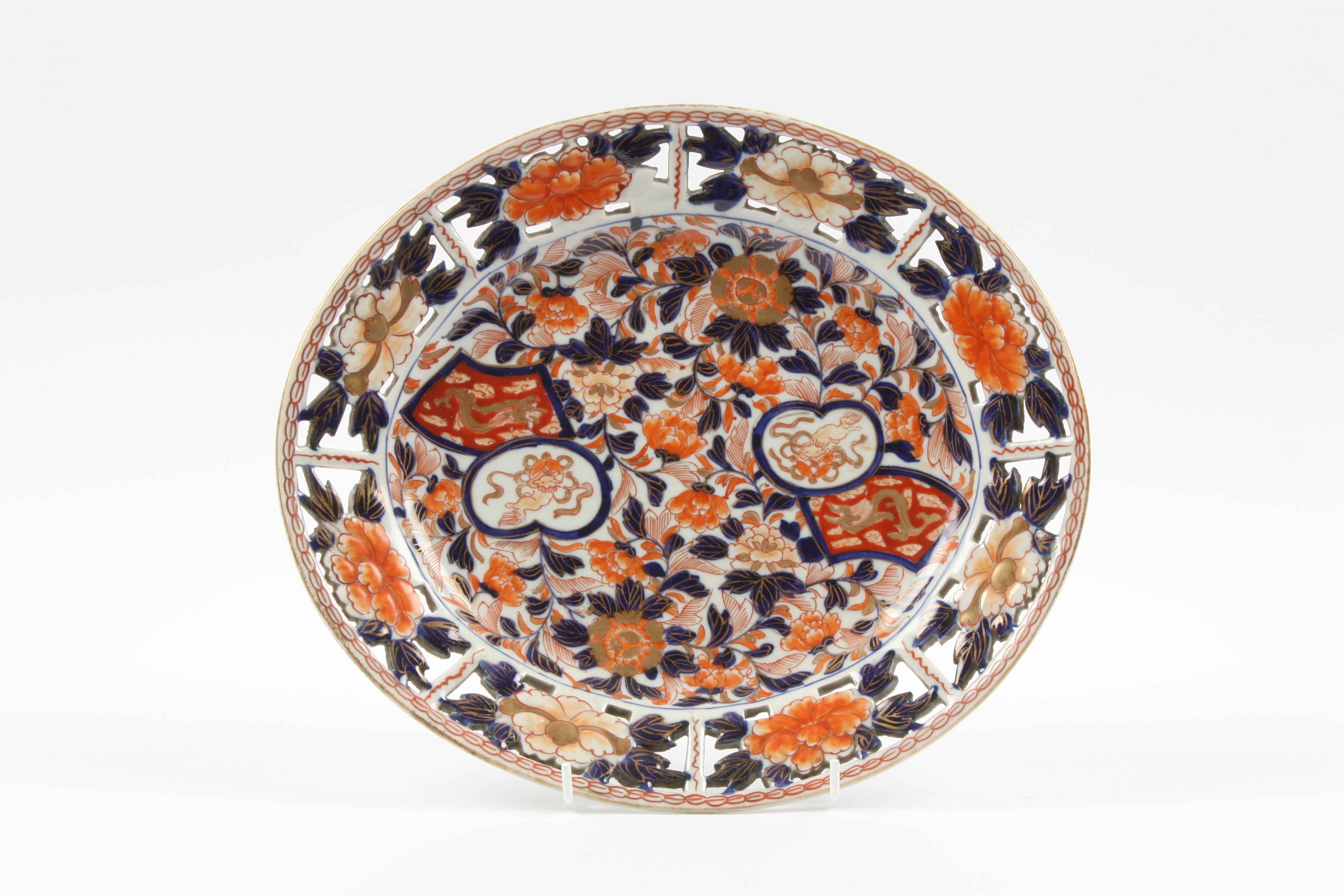 A 19th century Japanese Imari oval platter with pierced rim, decorated with smalls panels of animals