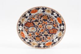 A 19th century Japanese Imari oval platter with pierced rim, decorated with smalls panels of animals