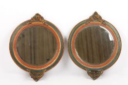 A pair of Barbola mirrors each mirror carved with floral decoration, and painted with alternative
