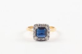 An Art Deco style 18ct gold, sapphire and diamond ring hallmarked London 1975, set with central