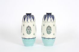 A pair of Minton Secessionist tall vases early 20th century with tube lined decoration of flower