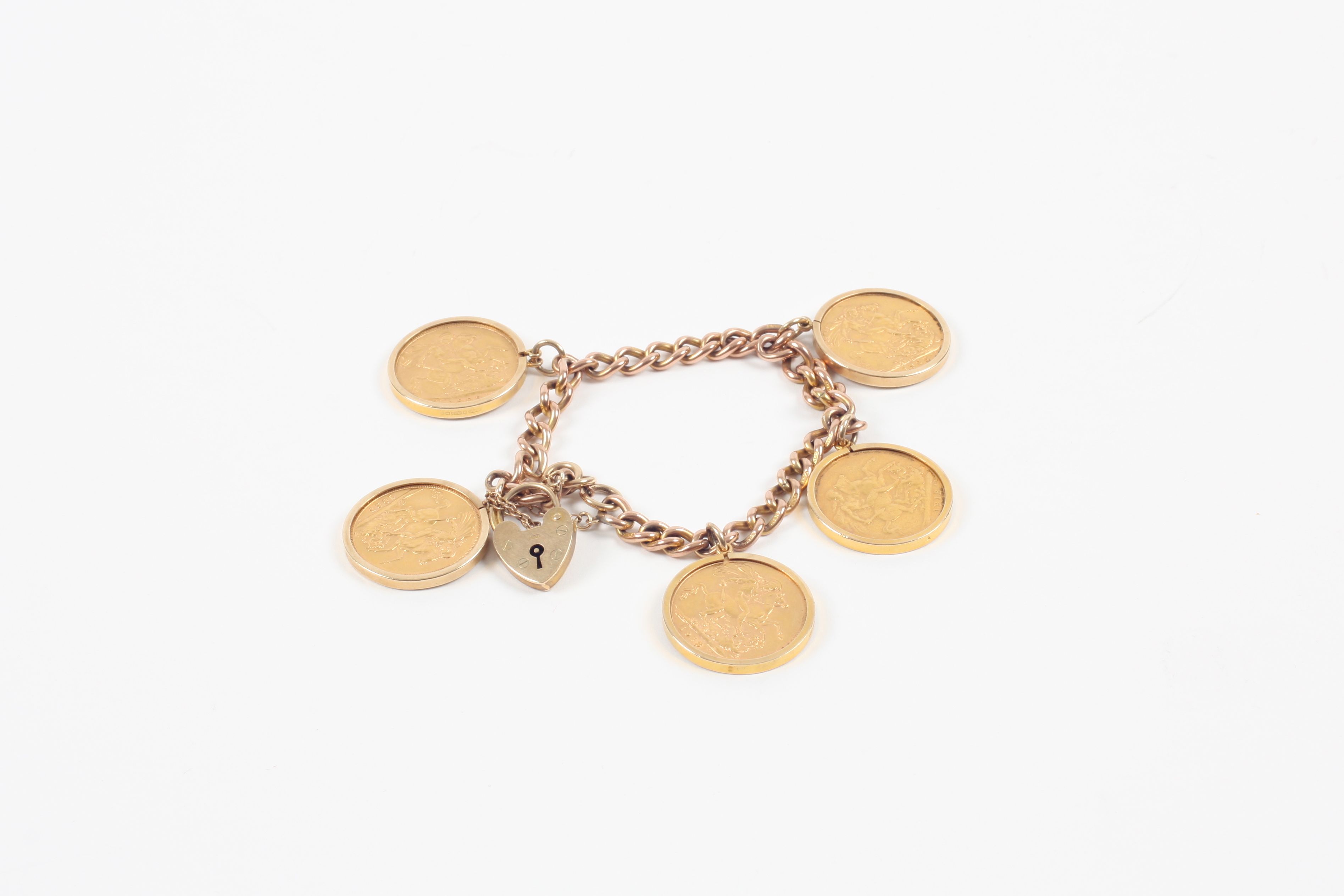 A gold bracelet set with five full sovereigns dated 1909, 1913 (2), 1925, and 1965, all in 9ct