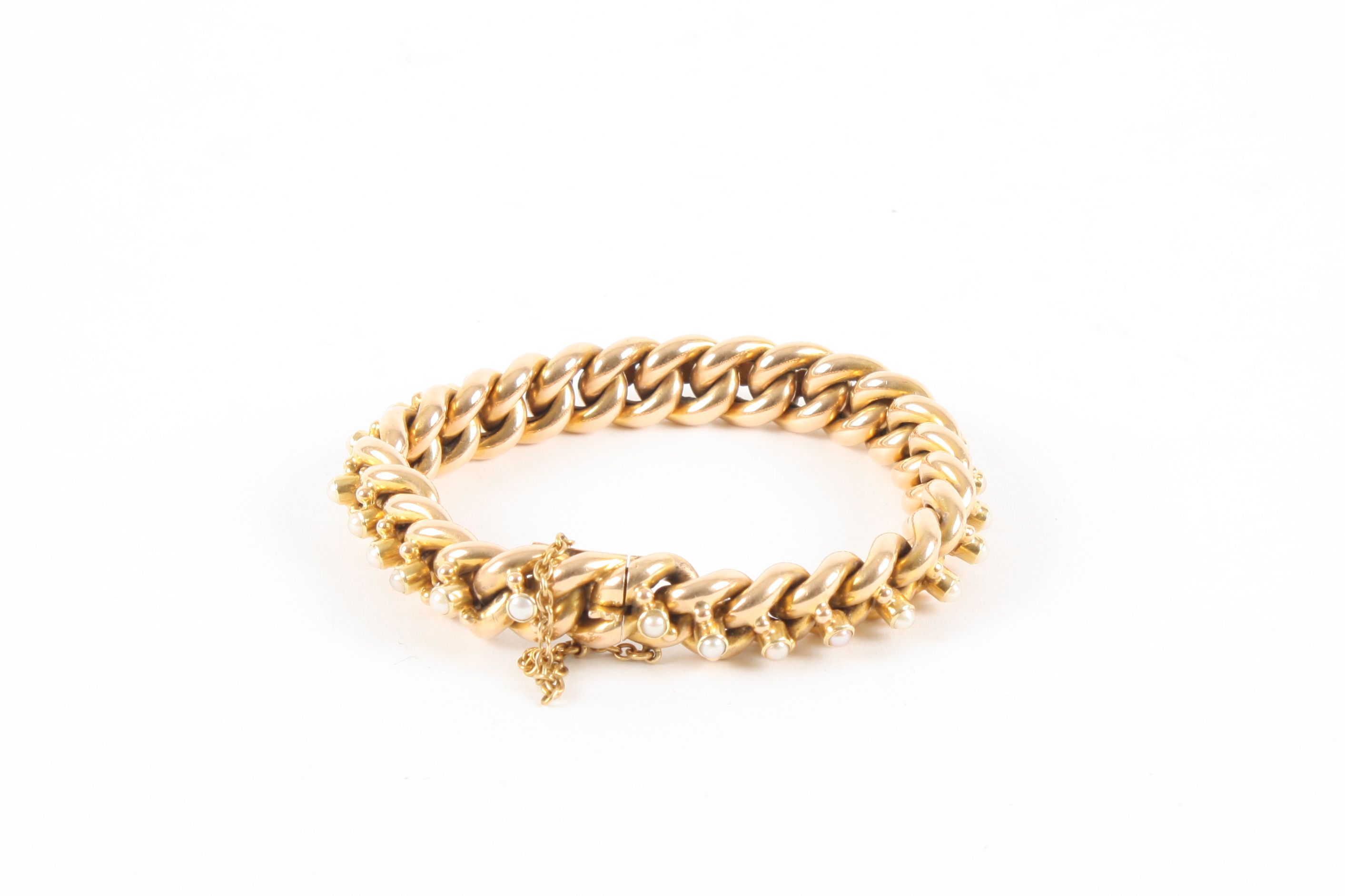 A Victorian 15ct yellow gold and seed pearl bracelet converted from a chain, each link set with a