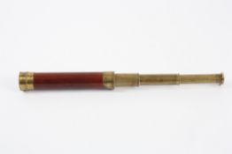 A mid 19th century three draw mahogany and brass refracting telescope unsigned, with lens cap and