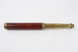 An early 19th century two draw brass and mahogany day or night refracting telescope signed C. West