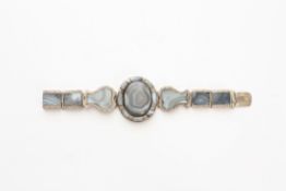 An early 20th century Continental banded agate and silver bracelet with central oval panel flanked