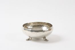 An Arts & Crafts hammered white metal bowl early 20th century, probably silver but unmarked,