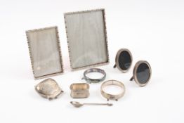 A collection of assorted silver items comprising: two Birmingham 1978 and 1980 silver photograph