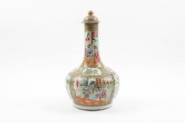 A large 19th century Chinese famille rose bottle vase and cover the body decorated with panels of