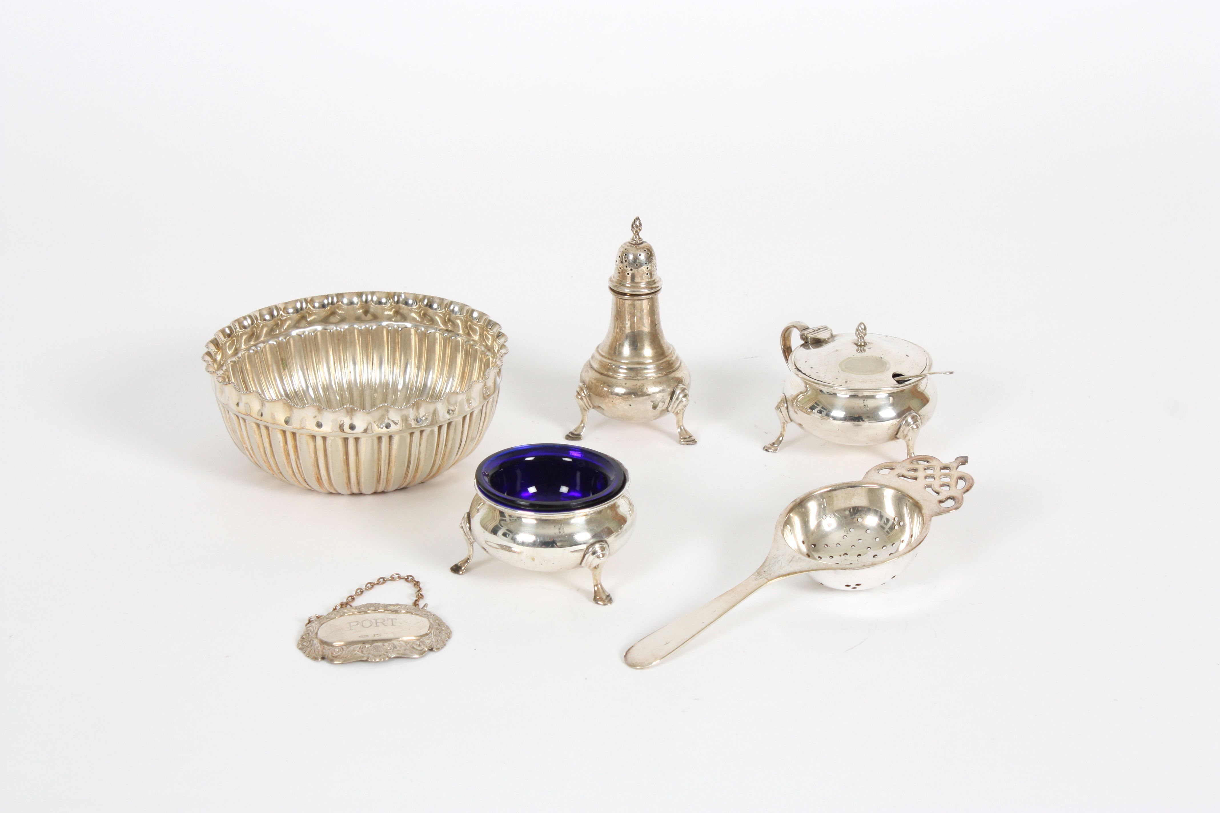 A small collection of silver and silver plate comprising a silver cruet set hallmarked London