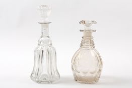 Two Victorian glass decanters One of bell shaped form, the other with facet cut sides and star cut