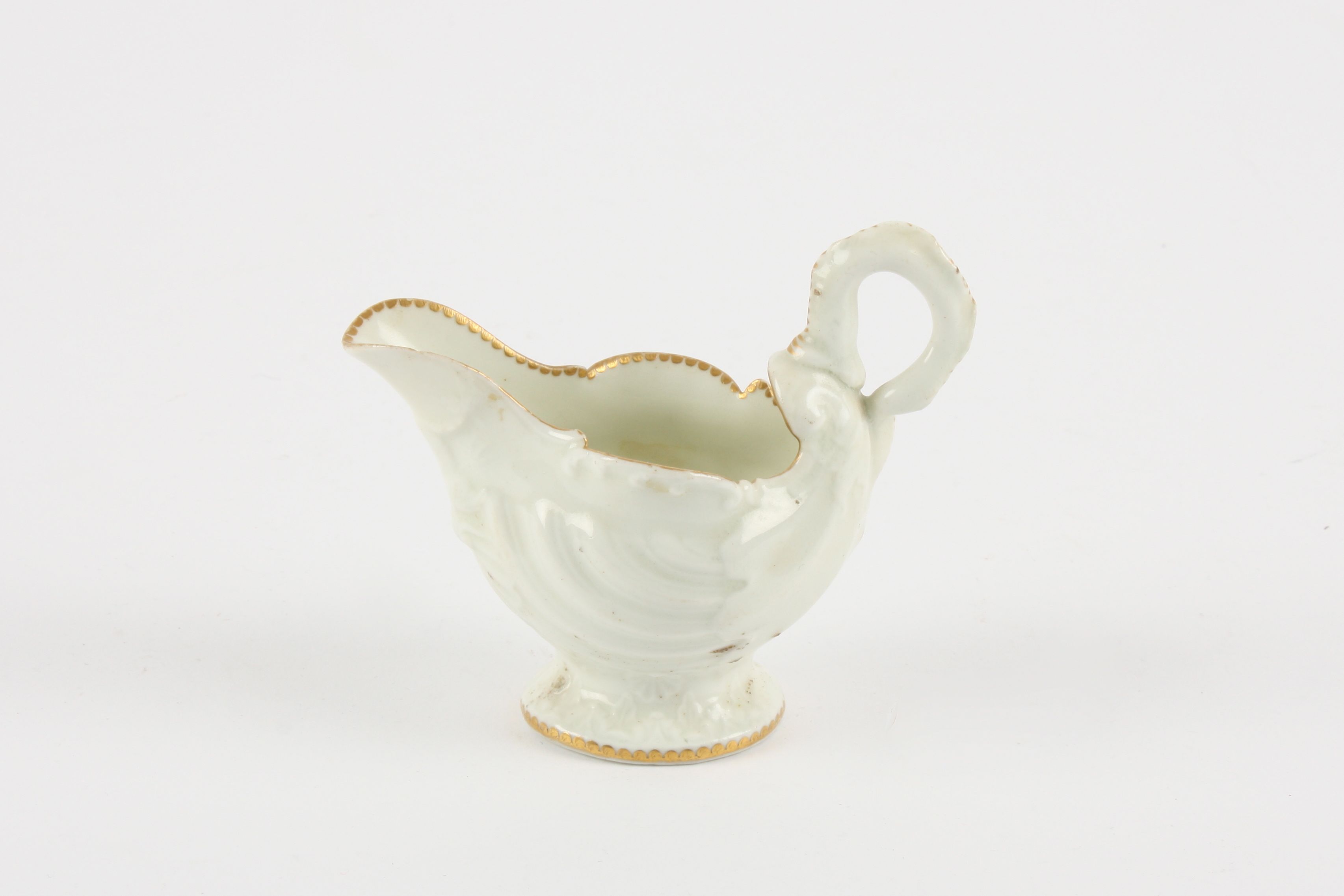 An 18th century porcelain dolphin ewer creamboat Worcester circa 1770 of traditional moulded shell