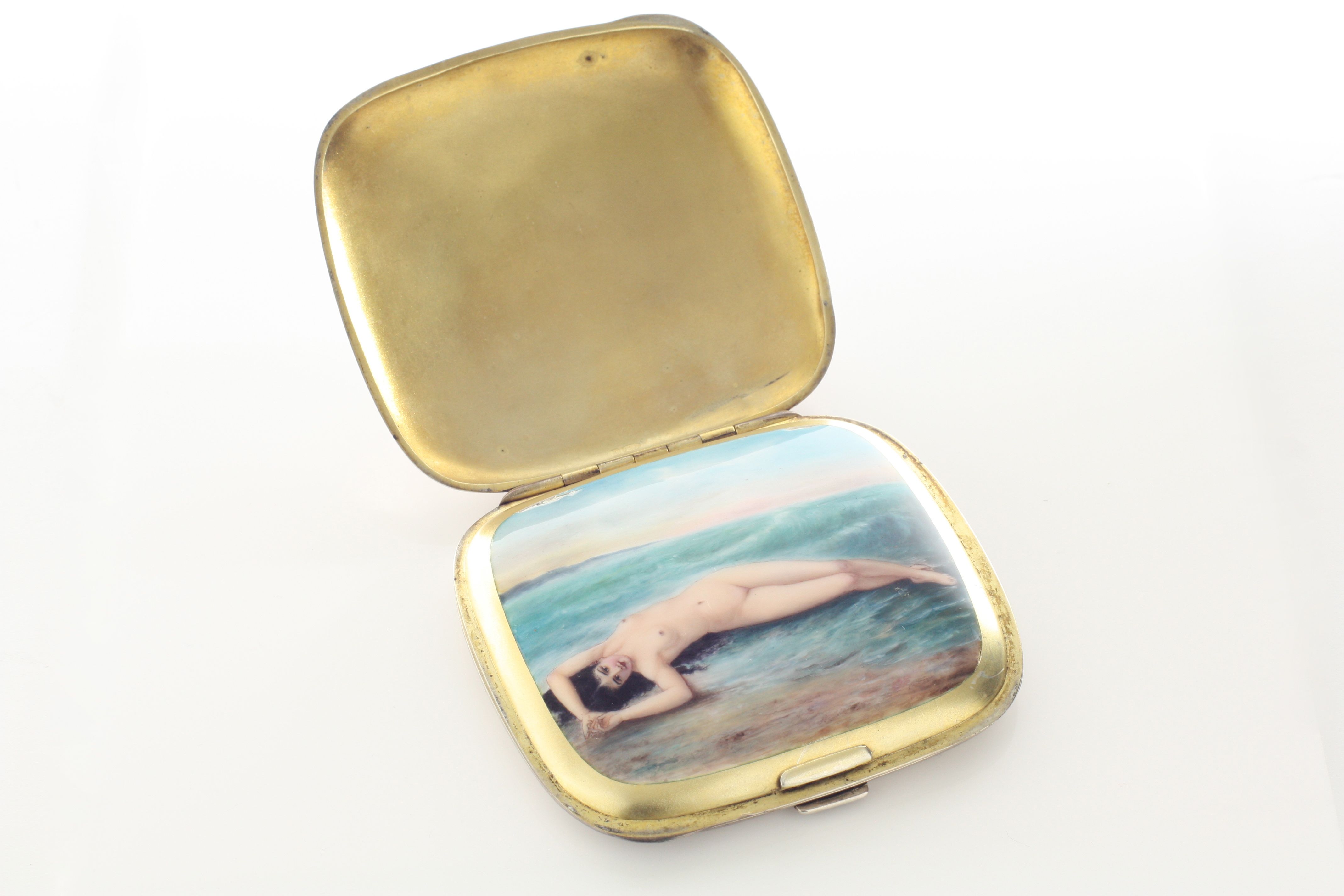 An early 20th century Continental silver and enamel erotic cigarette case with import hallmark for