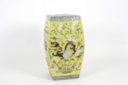 A 19th century Chinese porcelain square garden seat decorated with a four claw dragon amidst