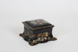 A Victorian papier-mâché scent bottle box containing four bottles the top and sides inlaid with