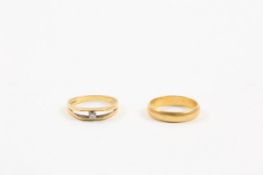 Two 18ct yellow gold rings comprising and wedding band and a diamond engagement ring set with 5pt