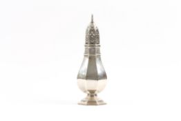 A George V silver octagonal sugar sifter hallmarked Birmingham 1928, of baluster form. 23cm high,