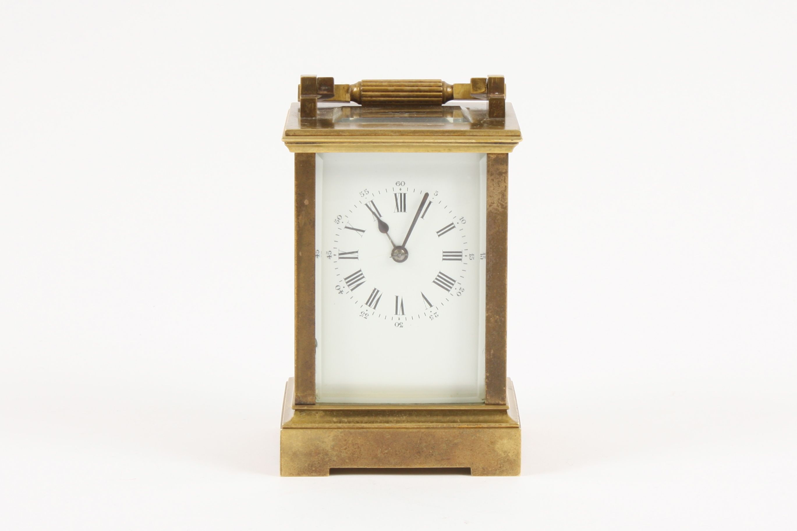 An early 20th century French by Richard and Cie brass carriage clock with white enamel dial, set