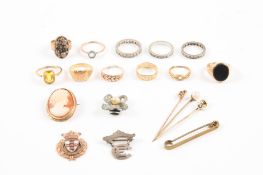 A collection of assorted 9ct and 18ct gold rings comprising eleven assorted rings, three brooches,