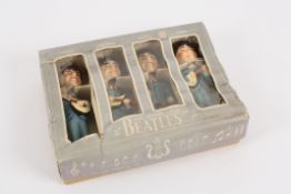 A boxed set of car mascot `Bobb n` head` plaster of Paris Beatles dolls each doll with facsimile