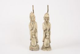 A pair of carved Chinese style white marble immortals converted to lamps, one base signed `E.T`