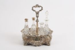 An early Victorian silver cruet stand with partial contents hallmarked London 1844, the body of