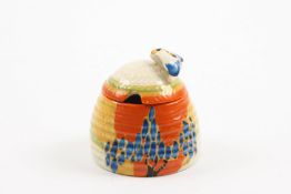 A Clarice Cliff Fantasque Bizarre `Windbells` honey pot and cover the lid with applied beel the body