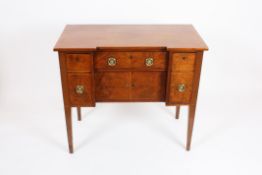 A George III mahogany inverted breakfront sideboard  of small proportions, with flamed top over a