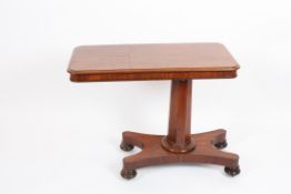 A Victorian mahogany reading table?the rectangular top with two ratchet action reading stands, on