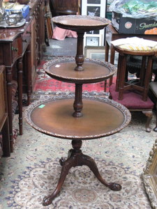 REPRODUCTION MAHOGANY THREE TIER DUMB WAITER ON BALL AND CLAW SUPPORTS