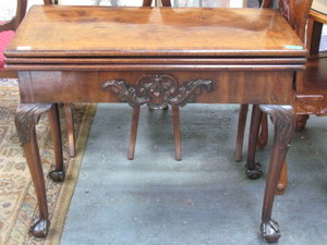 ANTIQUE  MAHOGANY DOUBLE FOLD OVER TEA TABLE WITH CARVED DECORATION ON BALL AND CLAW SUPPORT