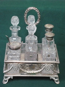 SILVER PLATED AND GLASS SIX PIECE CRUET SET