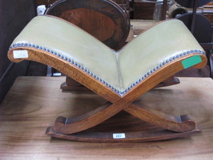 SMALL LEATHER UPHOLSTERED X-FRAMED ROCKING STOOL