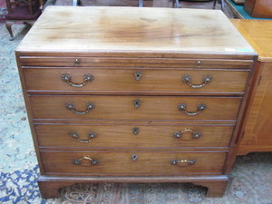 ANTIQUES MAHOGANY CHEST OF FOUR DRAWERS WITH BRUSH AND SLIDE