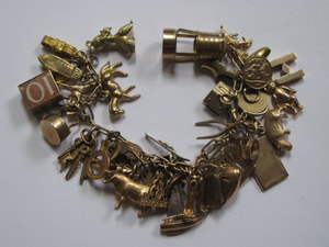 9ct GOLD CHARM BRACELET WITH APPROXIMATELY THIRTY-EIGHT CHARMS, APPROXIMATELY 76.2g