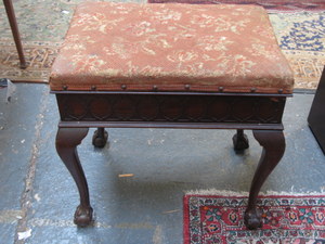 OLD REPRODUCTION MAHOGANY PIANO STOOL WITH EMBROIDERED SEAT ON BALL AND CLAW SUPPORT