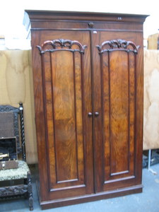 FLAMED MAHOGANY CARVED FRONTED TWO DOOR WARDROBE