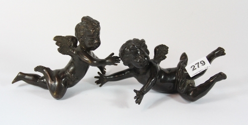 A pair of bronze cherub figures L 23cm