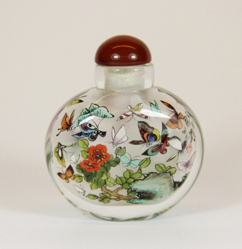 Xu Bu. A small intricately painted snuff bottle of butterflies H 5.5cm with signed box. Estimate £