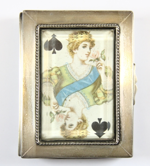 A lovely hallmarked silver playing card case containing a set of early playing cards