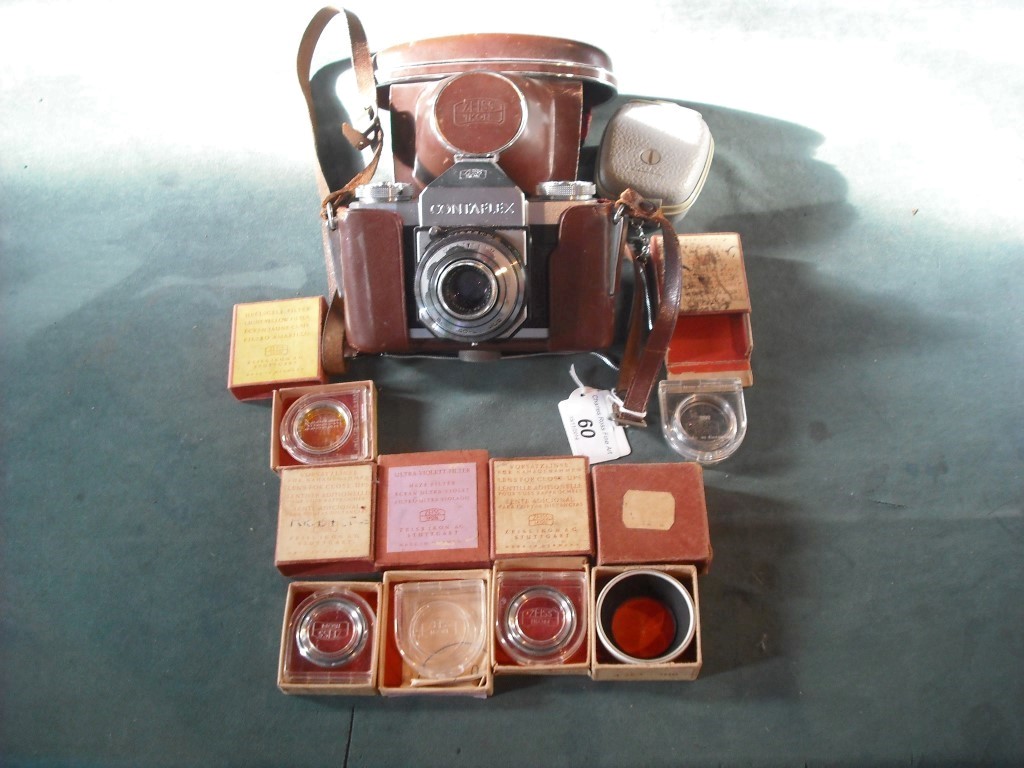 A Zeiss Ikon Contaflex camera, together with instruction manual, various lenses, filters and other